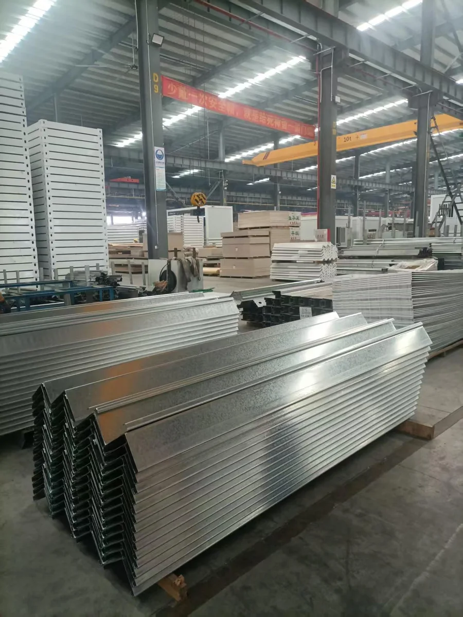 Bundles of formed galvanized steel profiles on the workshop floor